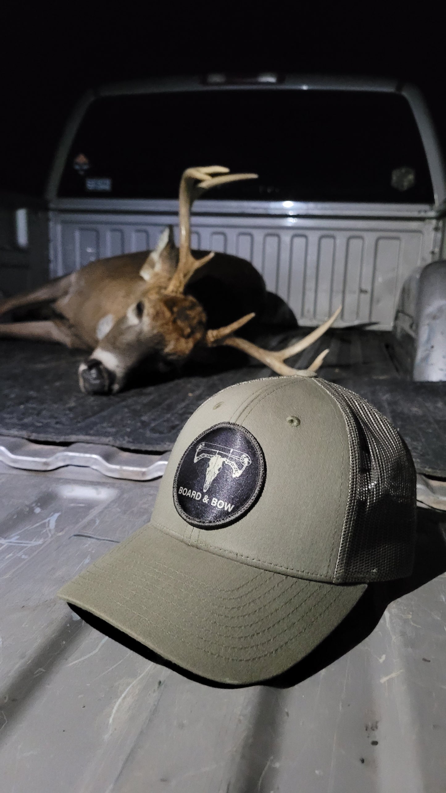 olive drab ball cap hat with black bowhead patch